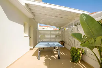 a table on the balcony of a house at Villa Athena in Protaras