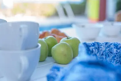 a group of green apples sitting on a table at Protaras Artisan Seafront Villa in Protaras