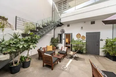 an outdoor patio with chairs and stairs and plants at Edem Traditional House in Larnaka