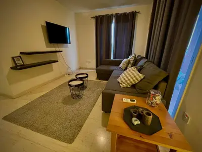 a living room with a couch and a coffee table at 3Bdr in Nicosia in Strovolos