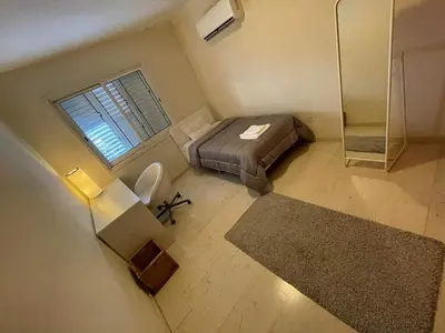 a small bedroom with a bed and a window at 3Bdr in Nicosia in Strovolos