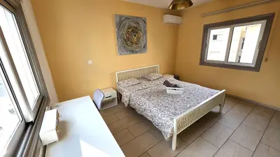 a bedroom with a bed and a window at Spacious Lightflooded 2BR Apt / Near Center & Harbour in Larnaka