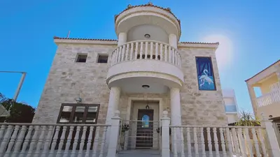 a building with a large tower with a balcony at STAY Ocean View Villa in Paralimni