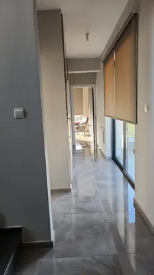 an empty hallway of a apartment with a room at Hanna Panorama Villa in Protaras