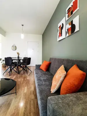 a living room with a couch and a table at Phaedrus Living City View Luxury Iras Flat 102 in Nicosia
