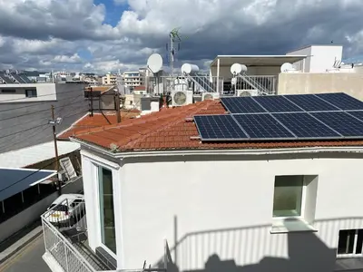 a roof with solar panels on top of a building at Appartments in the historic center near beach in Limassol