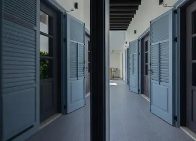 a row of blue doors in a hallway at The Sendal Boutique Hotel in Nicosia