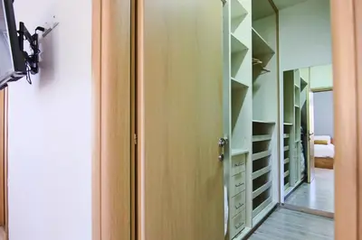 a dressing room with a mirror and a closet at Phaedrus Living City View Luxury Flat Harbour 04 in Larnaka