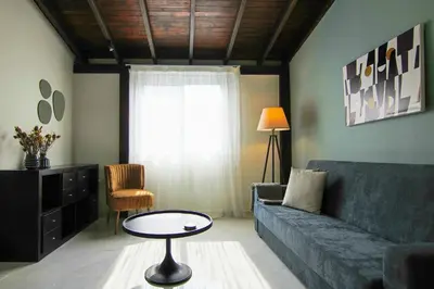 a living room with a couch and a table at Phaedrus Living City View Luxury Flat Harbour 04 in Larnaka