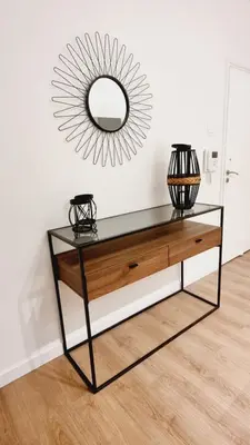 a console table with a mirror on the wall at Newly Renovated Super-Chic Apartment in Nicosia