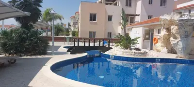 a swimming pool in the middle of a building at Pyla Palms Resort - 1 bedroom in Pyla
