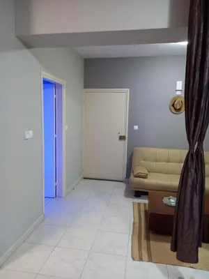 a living room with a couch and a door at Old Town studio apartment in Larnaka