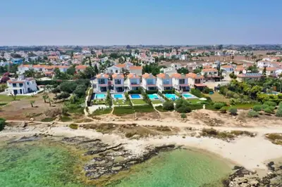 an aerial view of a large house on a beach at Villa Aphrodisia - Seafront in Ayia Napa