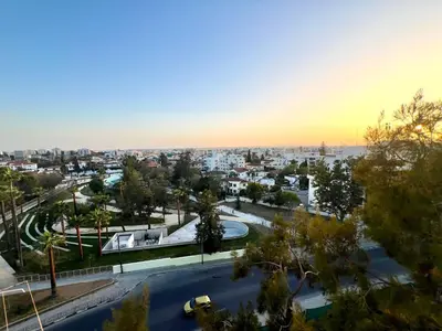 an aerial view of a city at sunset at Lina 703 in Larnaka