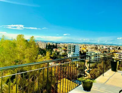 a balcony with a view of a city at Lina 703 in Larnaka