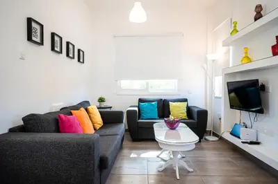 a living room with a couch and a table at Protaras View Villas in Protaras