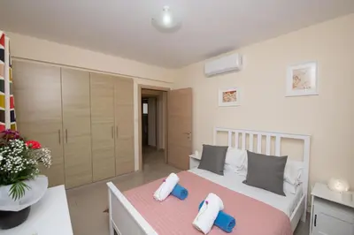 a bedroom with a bed with two pillows on it at Villa Helena in Ayia Napa