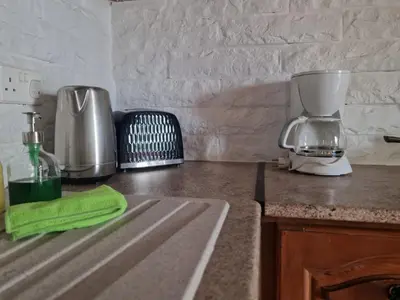 a kitchen counter with a mixer and a sink at Kalimera A Lovely 1-bedroom rental with ensuite and Kitchen in Limassol