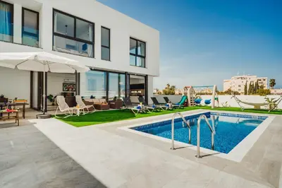 a swimming pool in the backyard of a house at SunnyVillas 4BR New Villa Private Pool in Pernera in Protaras