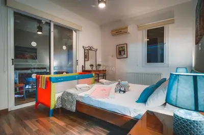 a childs bedroom with a bed and a window at Villa Emily in Protaras
