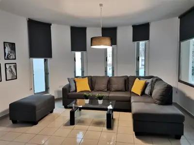 a living room with a couch and a table at City Flats 308 in Larnaka