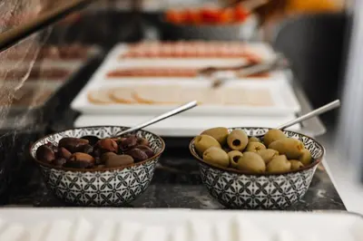 two bowls of different types of food on a counter at Limassol Del Mar in Limassol