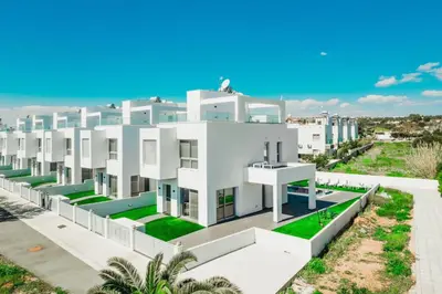 an image of a large white apartment building at Stay in Style in Modern 3 Bedroom Villas Near Nissi Beach & Square in Ayia Napa