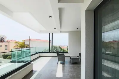 an indoor balcony with a view of a building at Phaedrus Living: City View Anna Residence 101 in Limassol