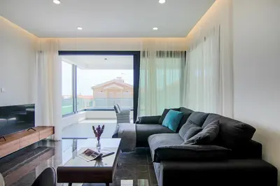 a living room with a couch and a table at Phaedrus Living: City View Anna Residence 102 in Limassol