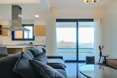 a living room with a couch and a glass table at Phaedrus Living: Sea View Anna Residence 201 in Limassol