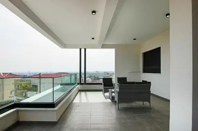 an open living room with a view of the city at Phaedrus Living: Sea View Anna Residence 202 in Limassol