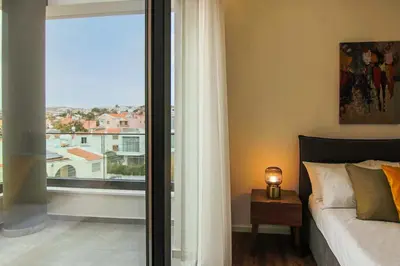 a bedroom with a bed and a large window at Phaedrus Living: Sea View Anna Residence 301 in Limassol