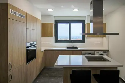 a kitchen with a sink and a window in it at Phaedrus Living: Sea View Anna Residence 301 in Limassol