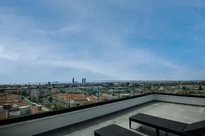 a balcony with a view of a city at Phaedrus Living: Sea View Anna Residence 301 in Limassol