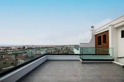 a balcony with a view of a city at Phaedrus Living: Sea View Anna Residence 301 in Limassol