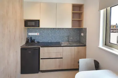 a kitchen with a sink and a dishwasher at Panas Villas in Ayia Napa