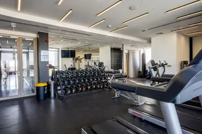 a gym with lots of treadmills and machines at 360 Nicosia - Luxury Apartment Panoramic View in Nicosia
