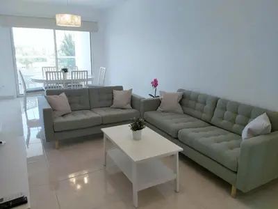 a living room with a couch and a table at Dinglis Residences 31 in Larnaka
