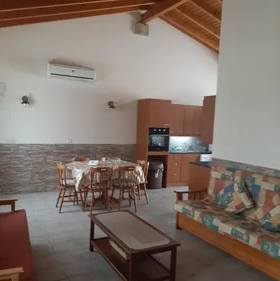 a kitchen and dining room with a table and chairs at HAVEN HOUSE in Larnaka