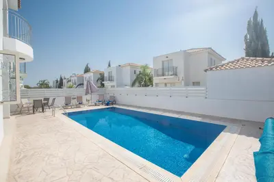 a swimming pool in the backyard of a villa at Palm Villa 17 in Protaras