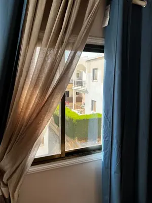 a window with a view of a yard at Ayia napa rest in Ayia Napa