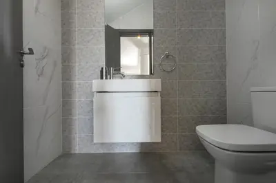 a bathroom with a sink and a toilet at Napa Bay View Villa in Ayia Napa