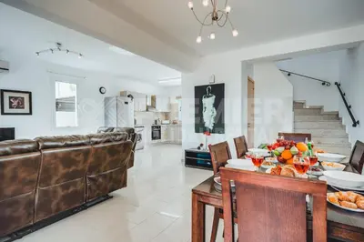 a kitchen and living room with a table with fruit on it at Villa Seaview in Protaras