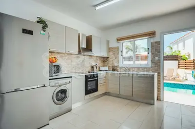 a kitchen with a washer and dryer at Villa Seaview in Protaras