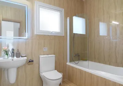 a bathroom with a toilet and a sink and a shower at LuxVillasRentals Ayia Napa in Ayia Napa
