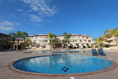 a large swimming pool in front of a building at Nissi 3 Amazing Sea View Apartment in Ayia Napa