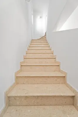 a staircase leading up to a white room with white walls at Villa millie Cyprus in Protaras