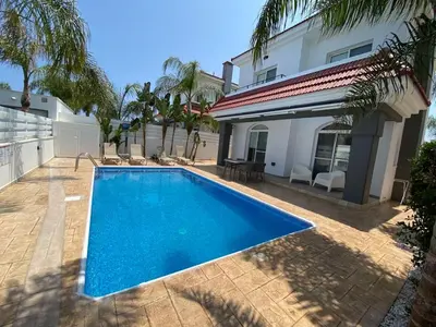 a swimming pool in front of a house at Villa Diana - 200 meters from Kapparis, Fireman's Beach in Paralimni