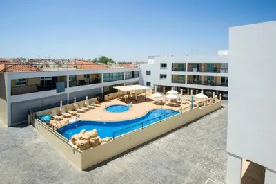 an overhead view of a swimming pool on a building at SEABREEZE APARTMENT 200m away from the sea in Paralimni