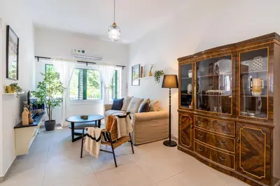 a living room with a couch and a table at Arty Haven - Spacious 3-BR House in Larnaca in Larnaka